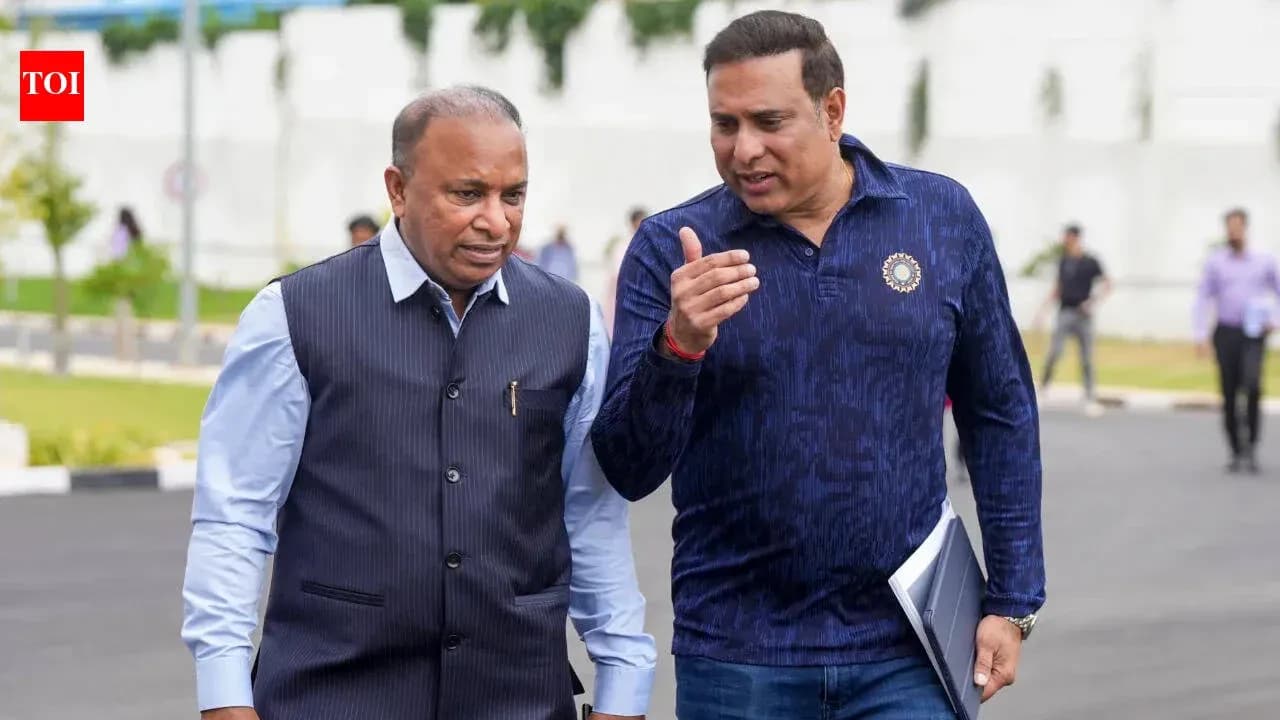 Two men walking and conversing outdoors