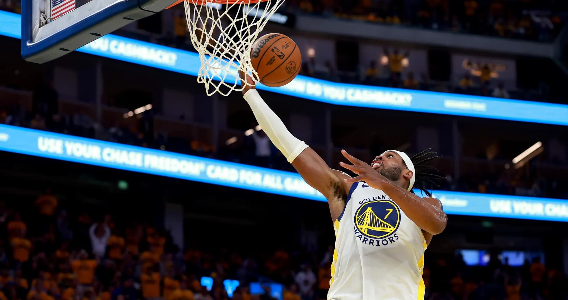 Player shooting a layup during basketball game