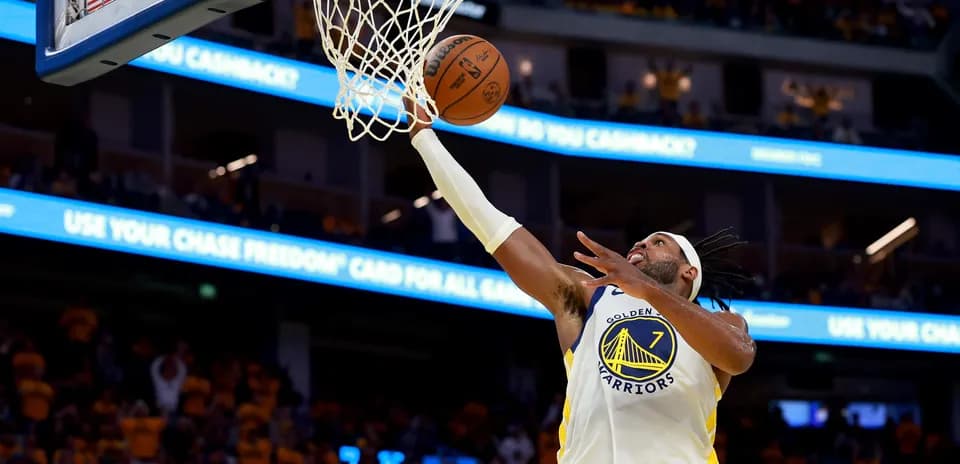 Player shooting a layup during basketball game