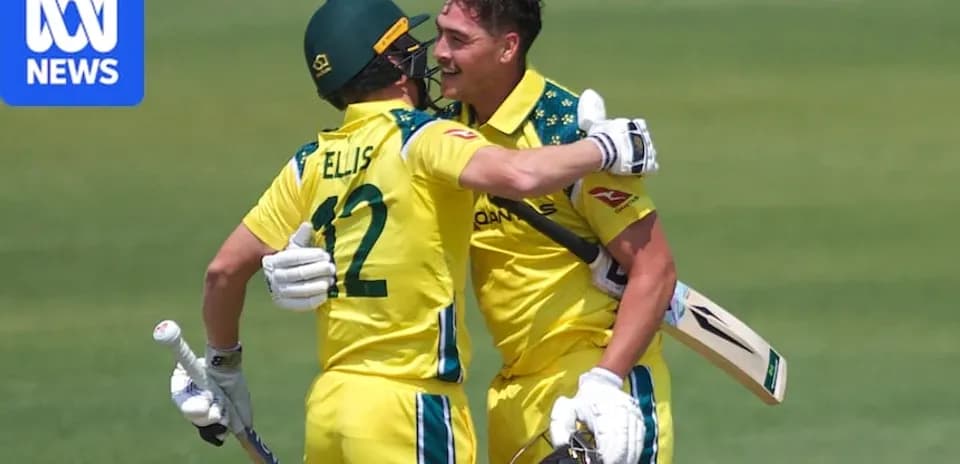 Two Australian cricketers celebrating a run