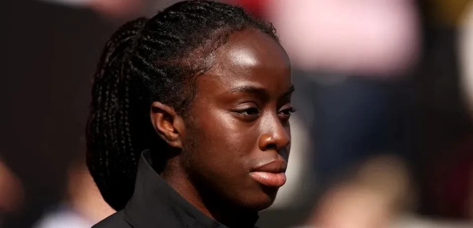 Athlete in a black jacket during event