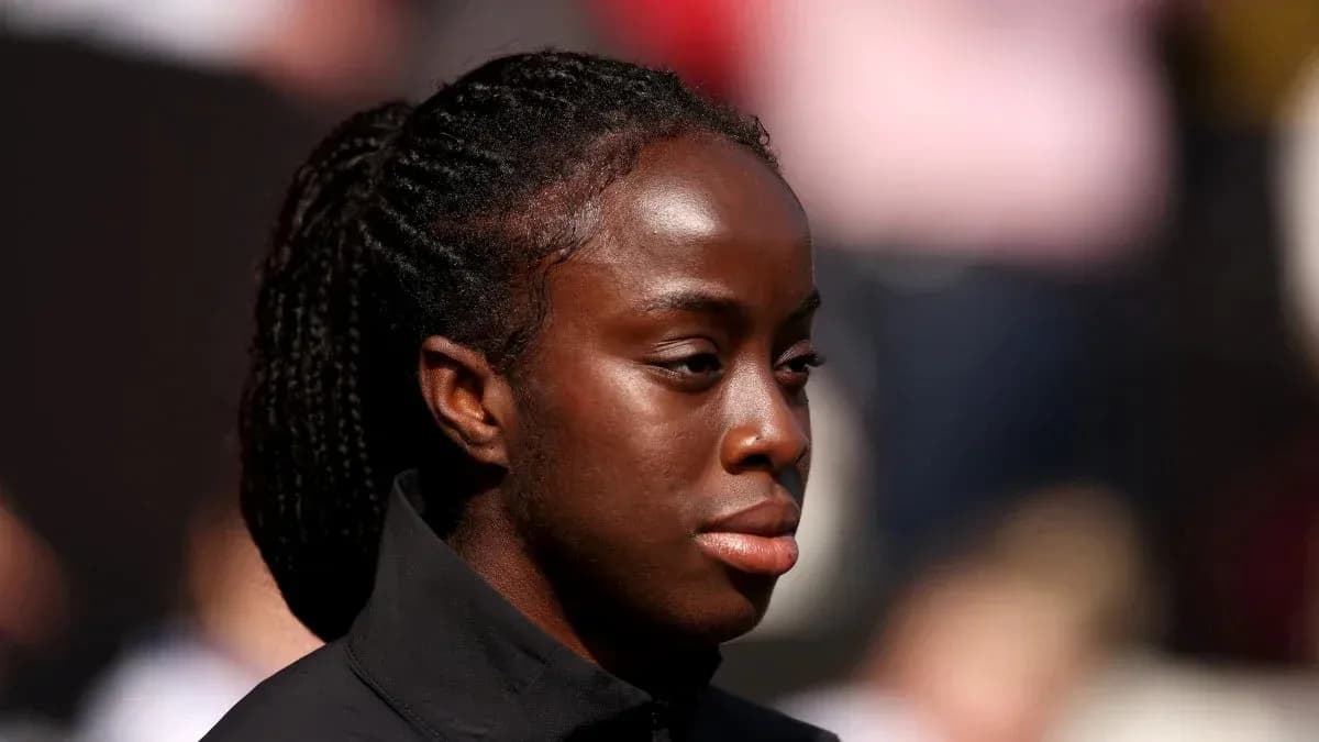 Athlete in a black jacket during event
