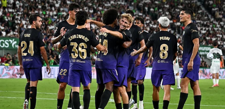 Players celebrating a goal during a football match