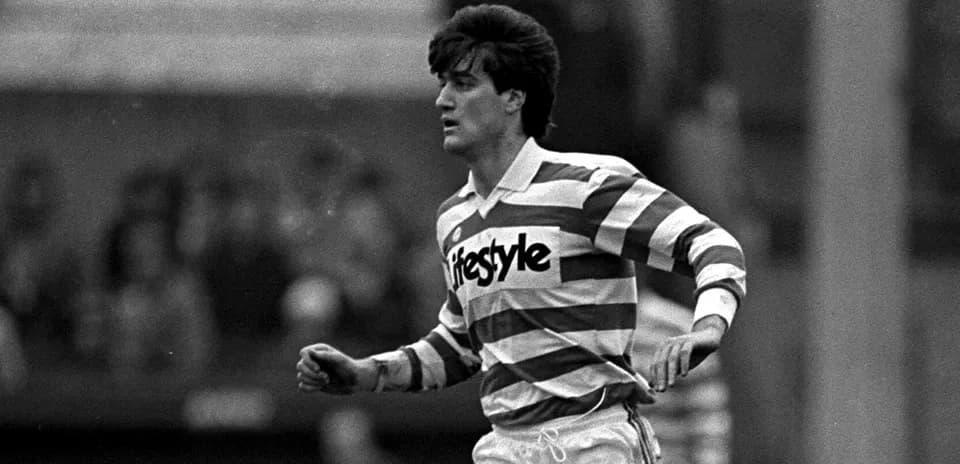 Player in striped jersey running on the field