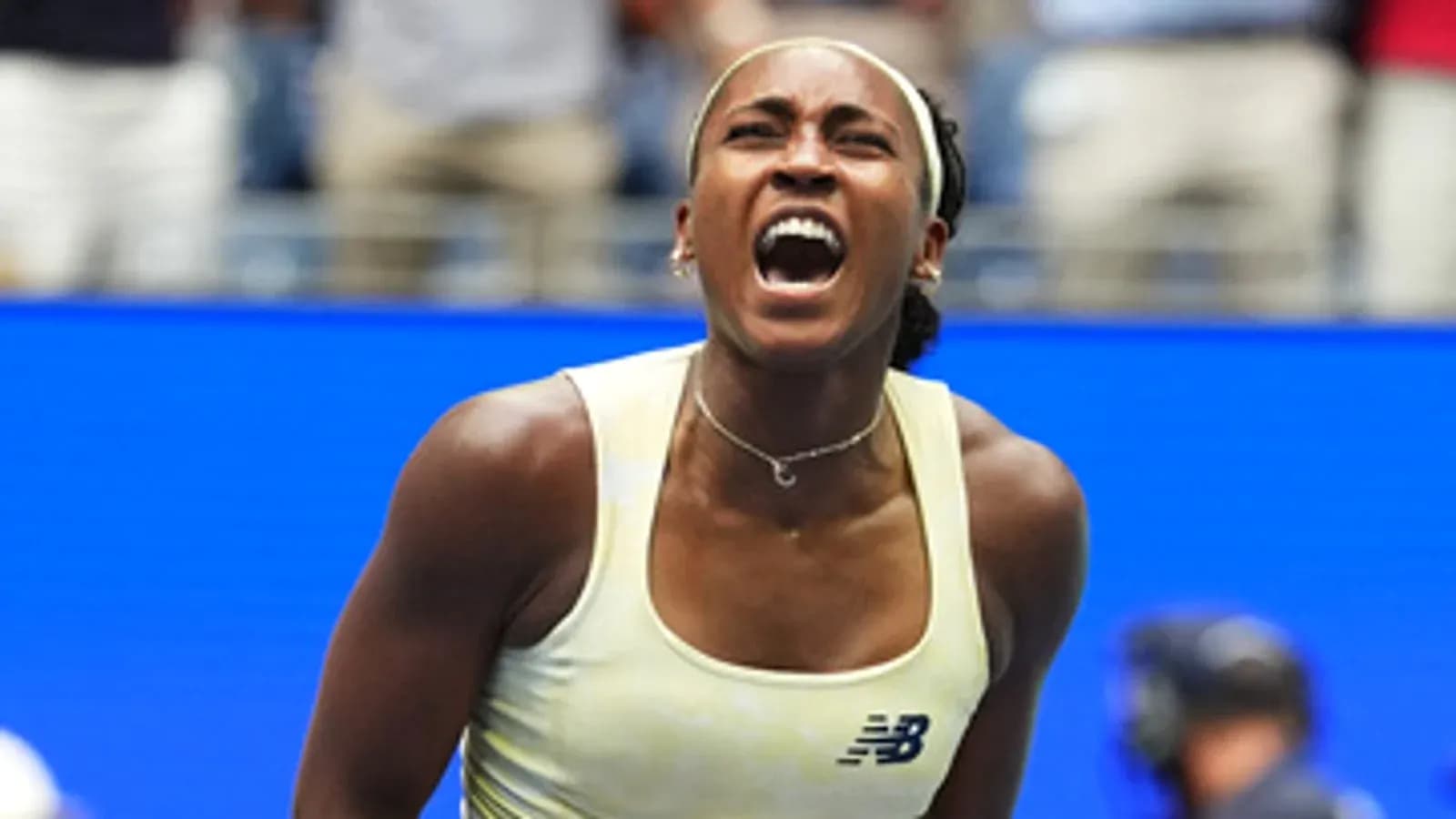 Tennis player celebrating a victory on court