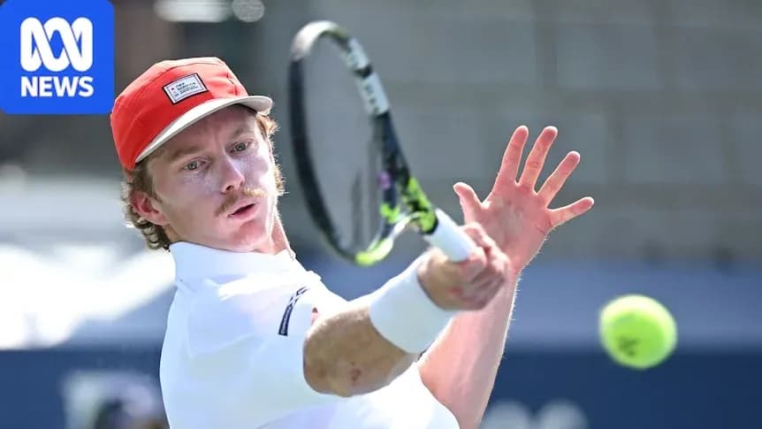 Tennis player hitting a backhand shot during match