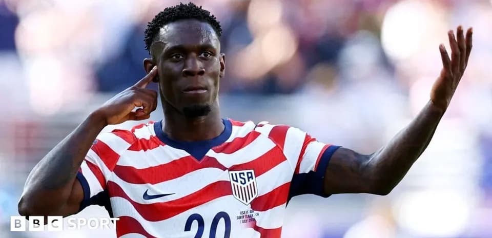 Player celebrating with hand to ear gesture