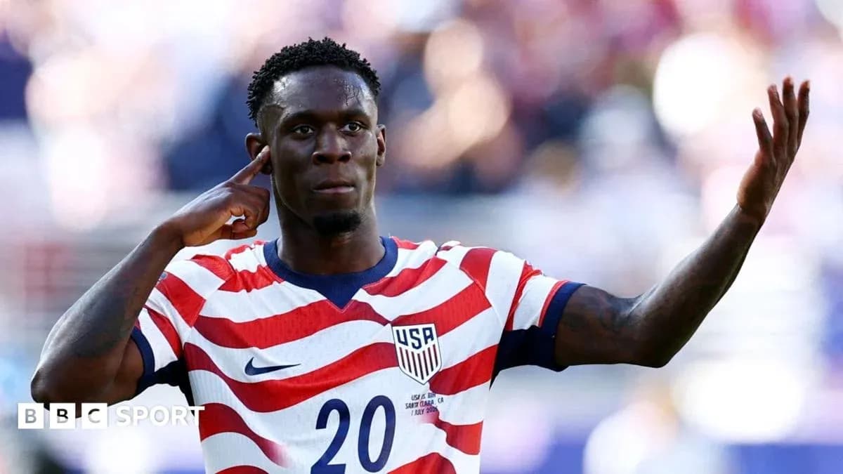 Player celebrating with hand to ear gesture