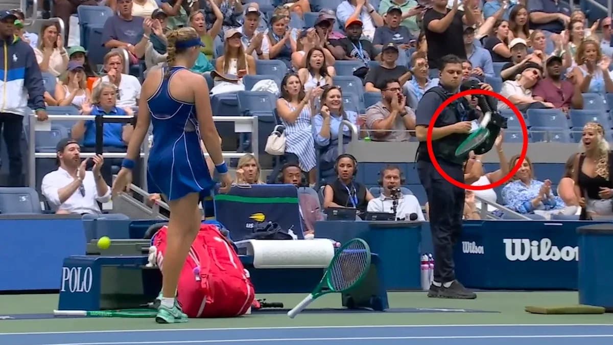 Player preparing to serve with crowd applauding
