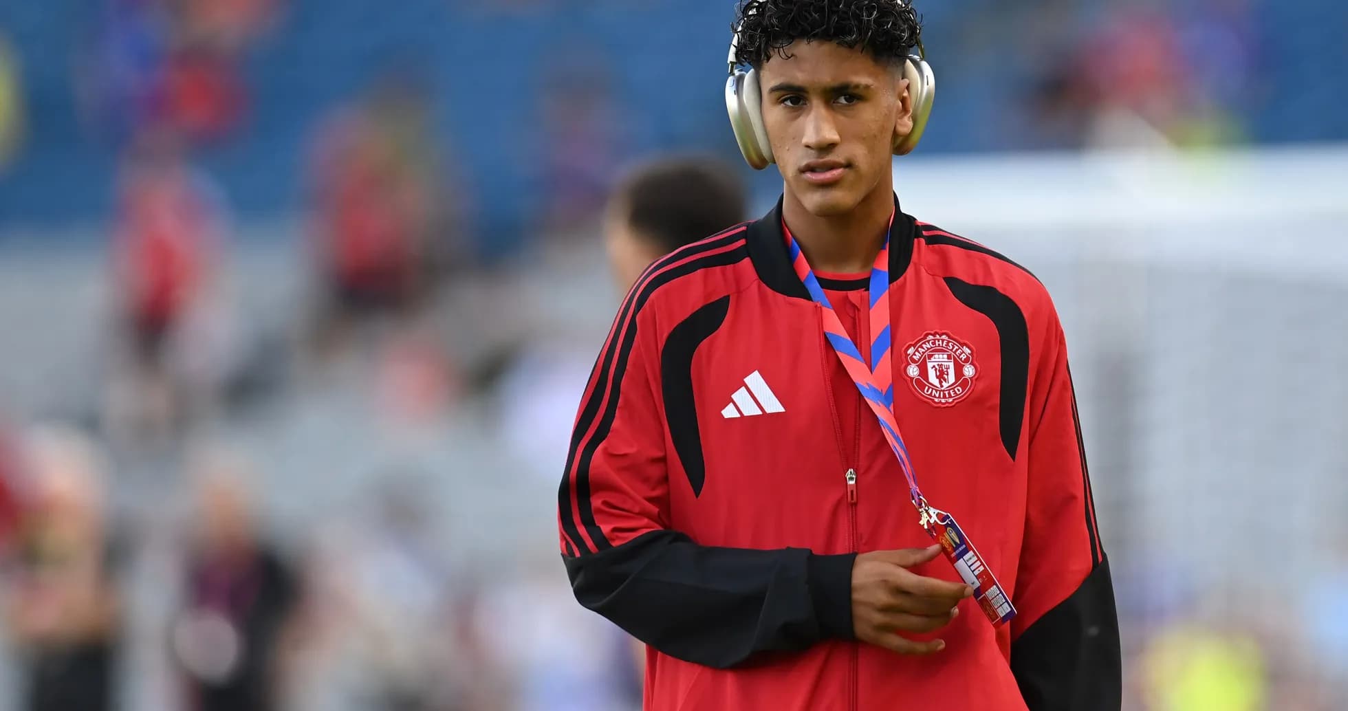Player wearing headphones before match warm-up