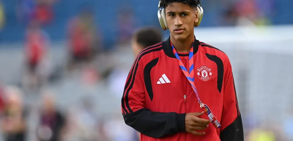 Player wearing headphones before match warm-up