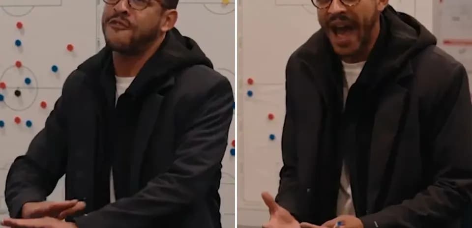Coach explaining strategy in front of tactics board