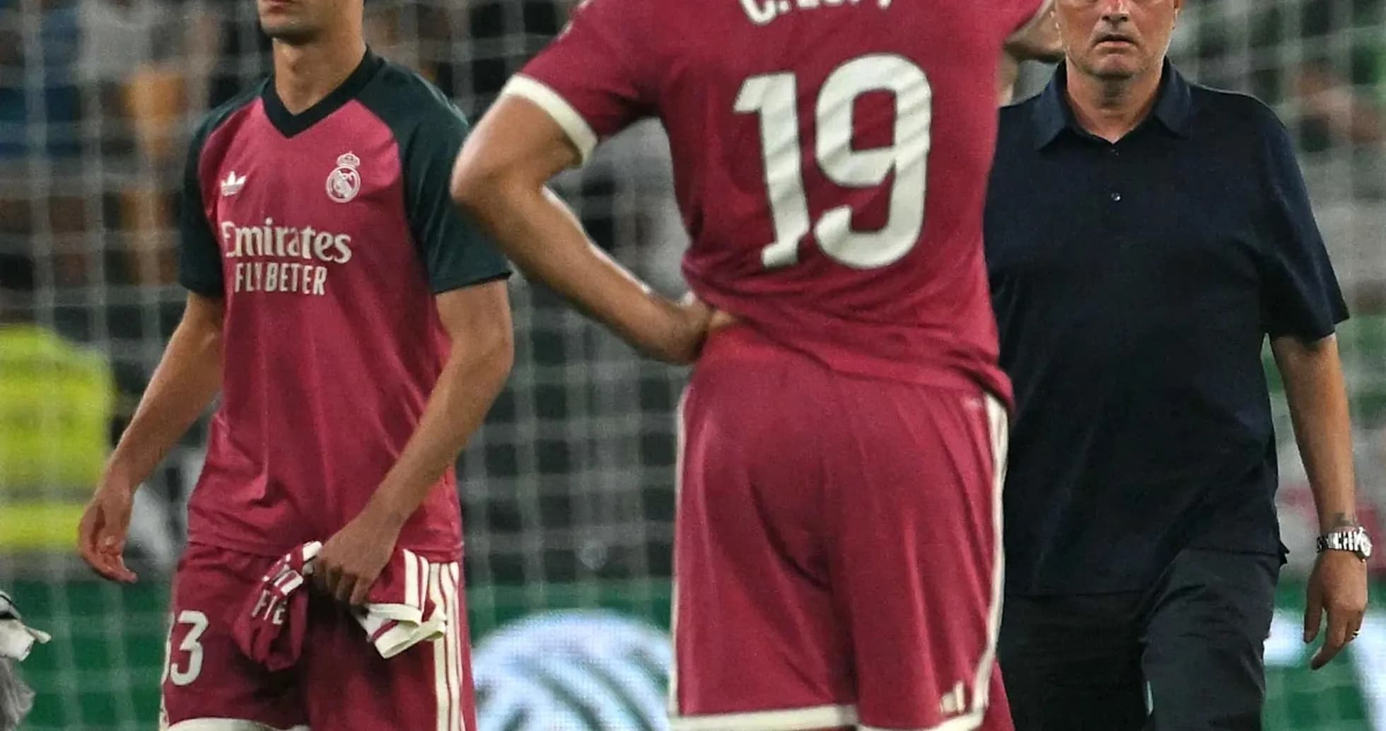Players and coach reacting during a match