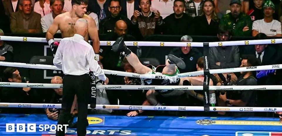 Boxer falling out of the ring after knockout