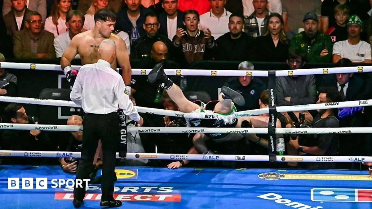 Boxer falling out of the ring after knockout
