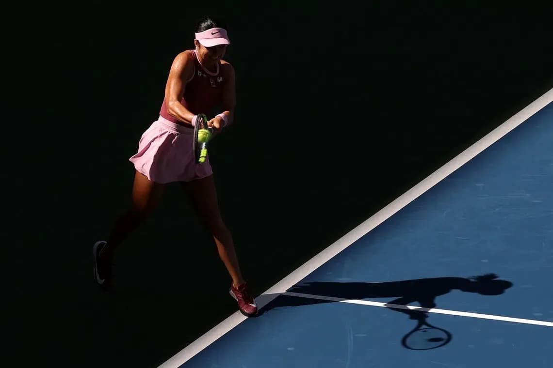 Player hitting a tennis ball on the court