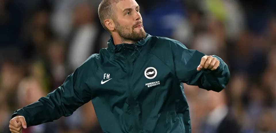 Man celebrating on the sidelines during a match