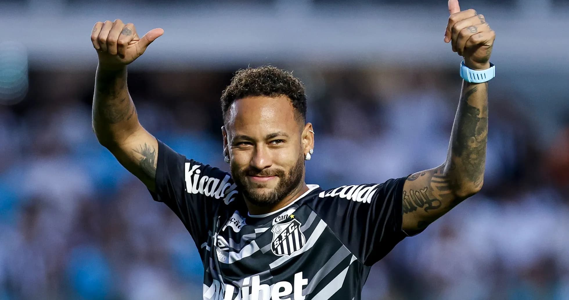 Player celebrating with thumbs up after match