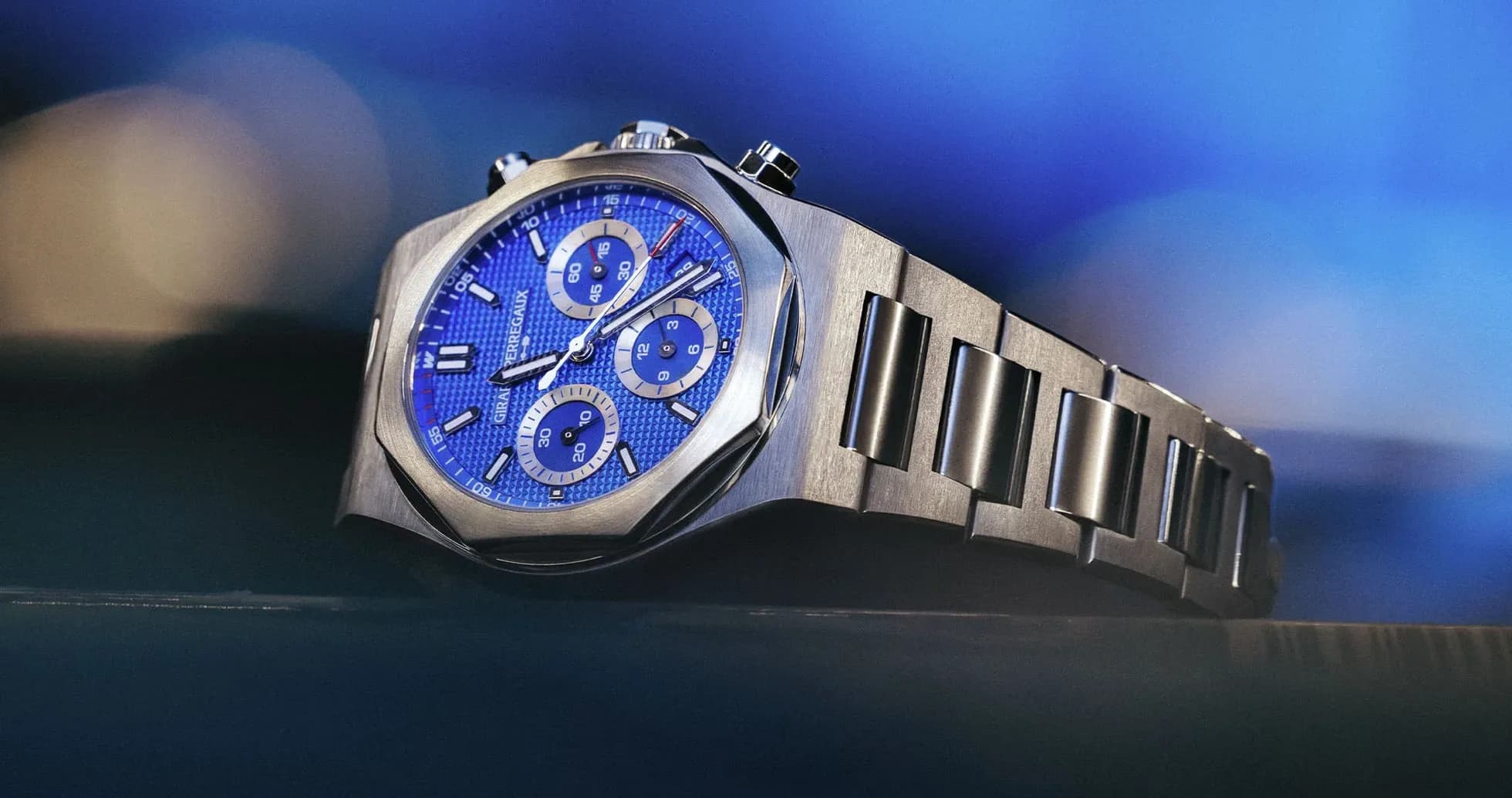 Close-up of a blue chronograph watch on display
