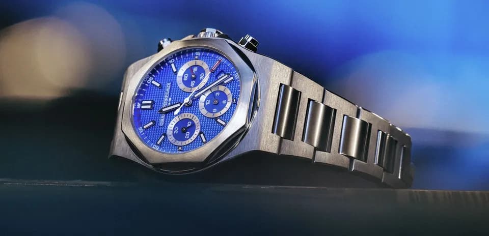 Close-up of a blue chronograph watch on display