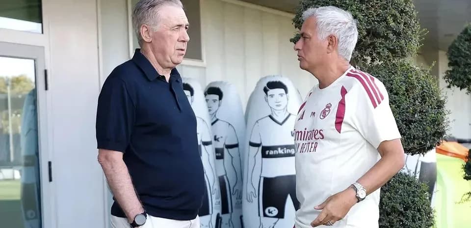 Two coaches discussing outside training facility