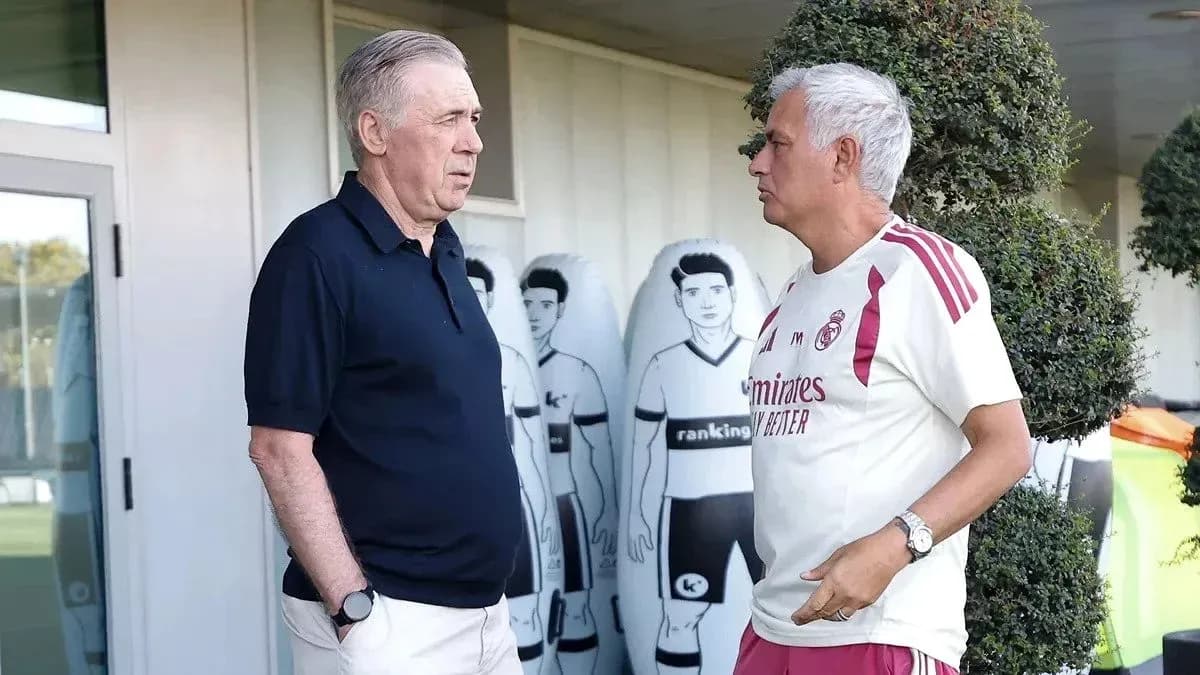 Two coaches discussing outside training facility