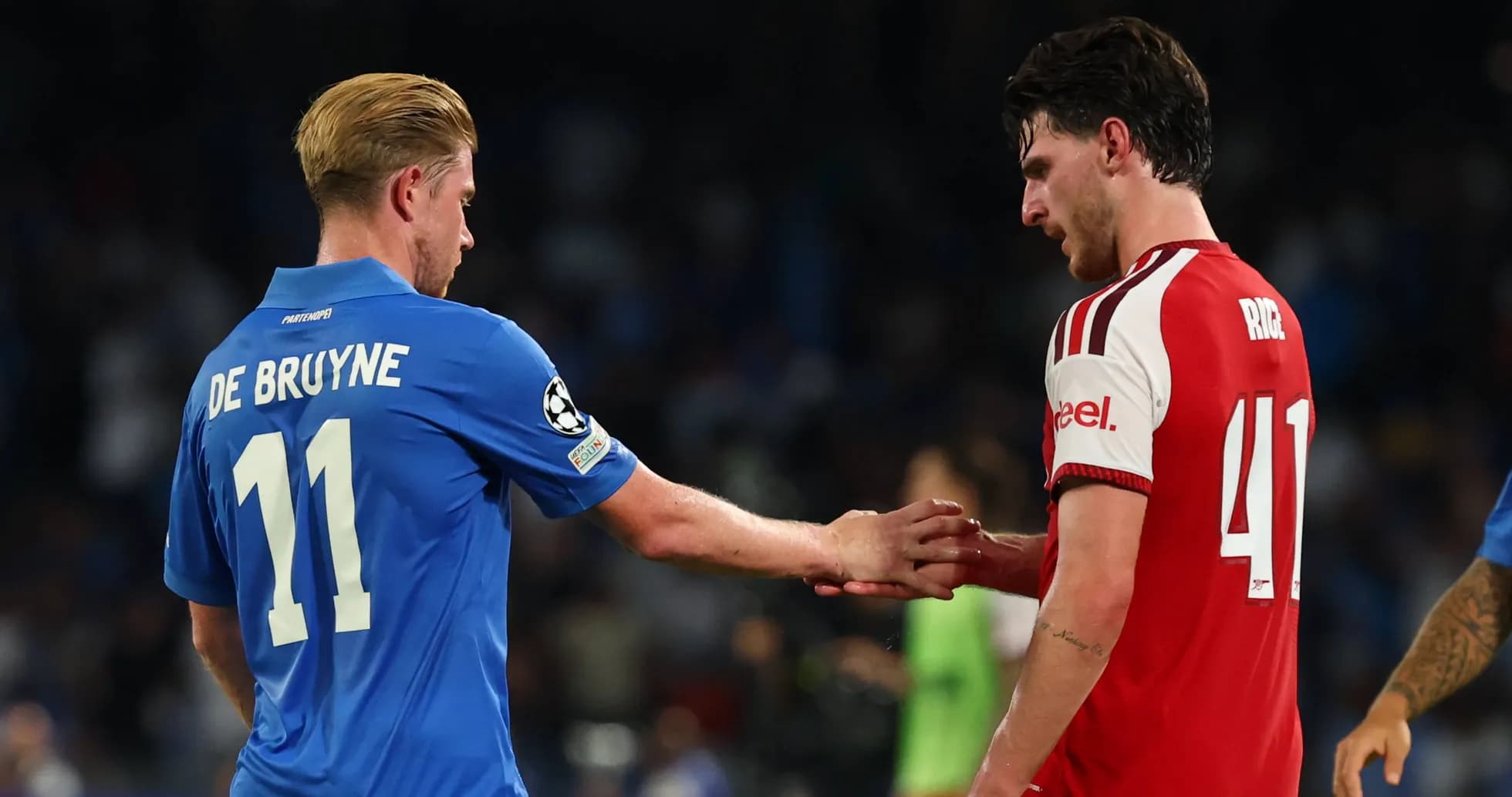 Two players shaking hands on the field