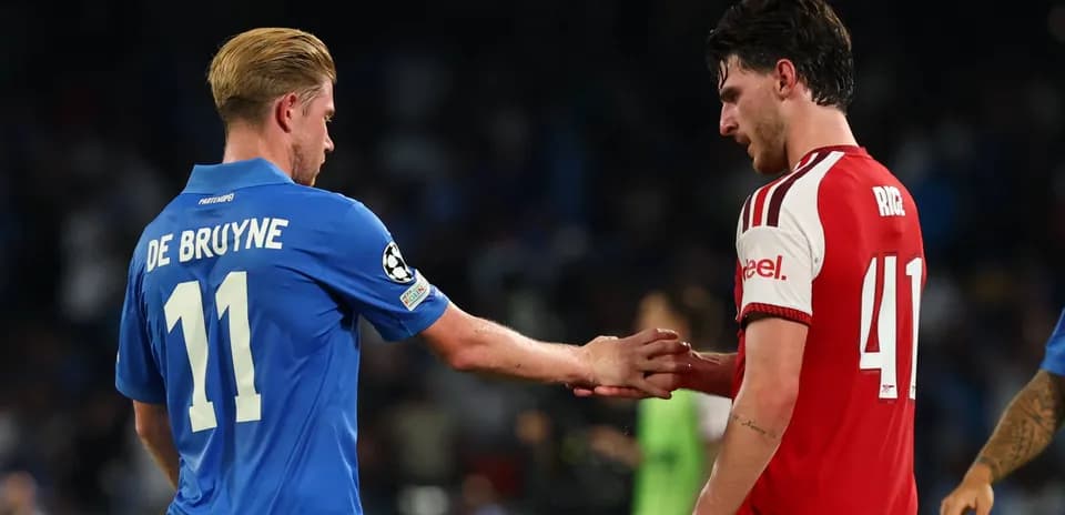 Two players shaking hands on the field