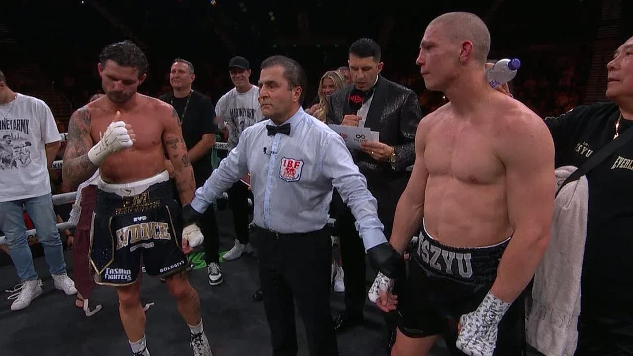 Boxers with referee after match announcement