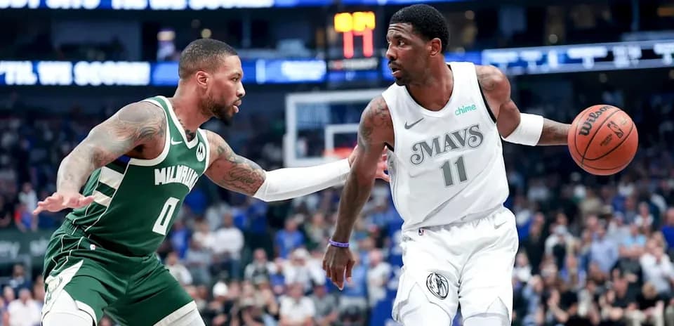 Player dribbling the ball while being guarded