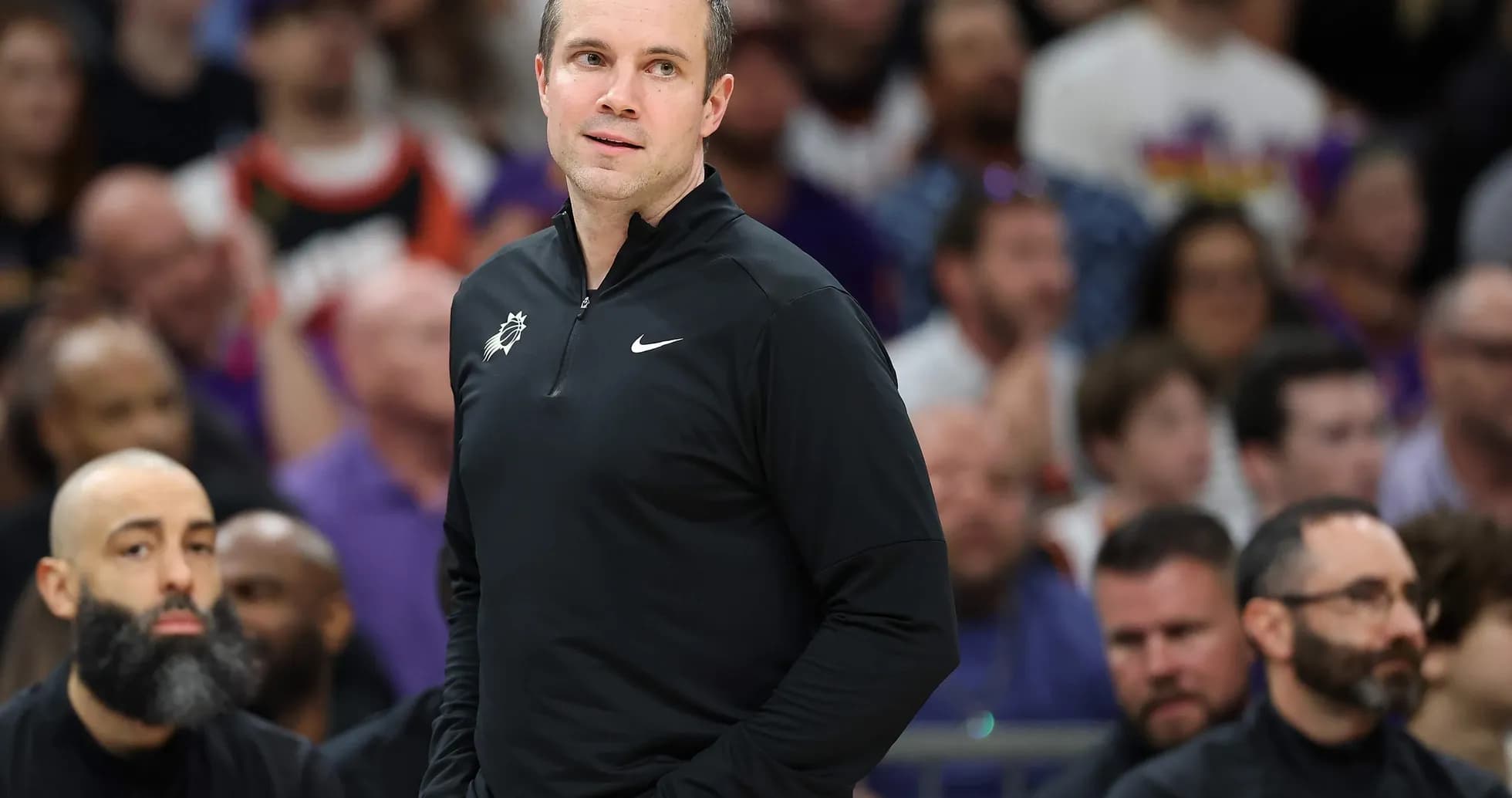 Coach observing the game from the sidelines