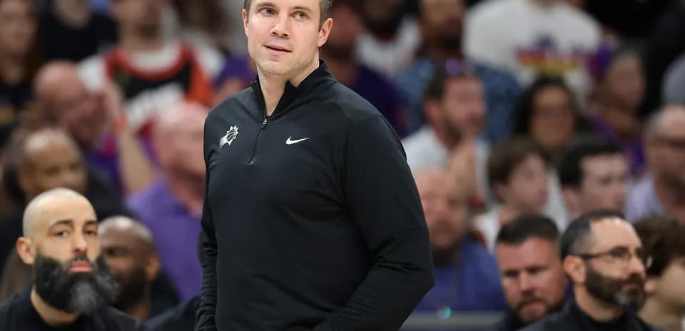 Coach observing the game from the sidelines