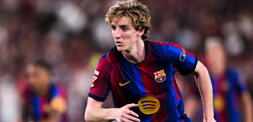 Player running during match wearing Barcelona kit