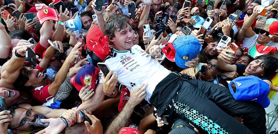 Driver celebrating with fans after the race