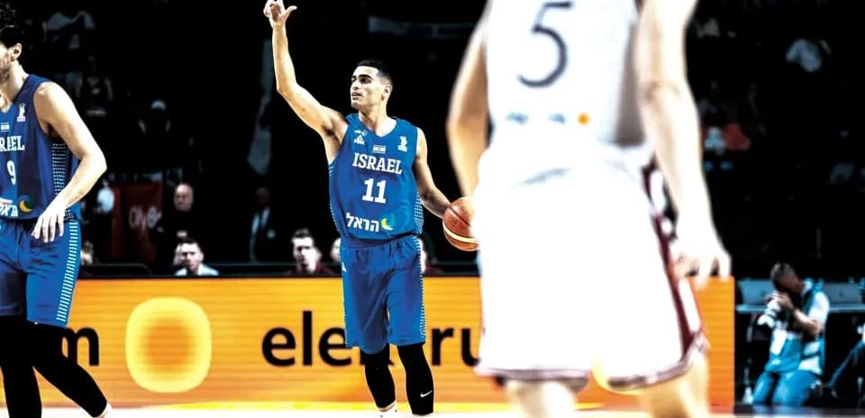 Player 11 signaling during a basketball game