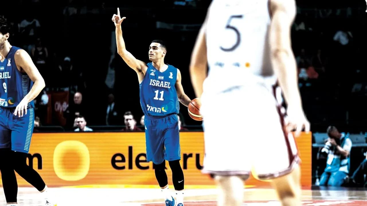 Player 11 signaling during a basketball game Player 11 signaling during a basketball game