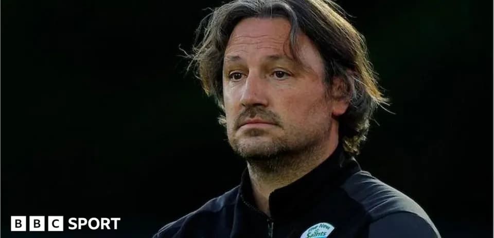 Coach observing the match from the sidelines