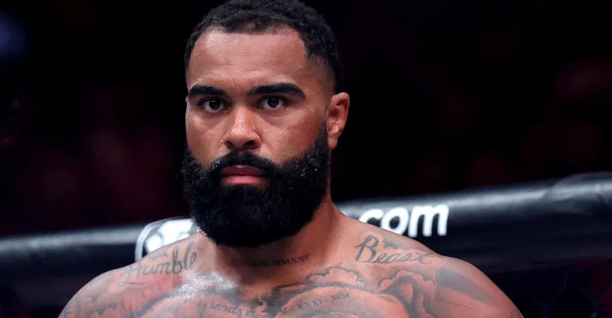 Fighter with tattoos staring intensely before match