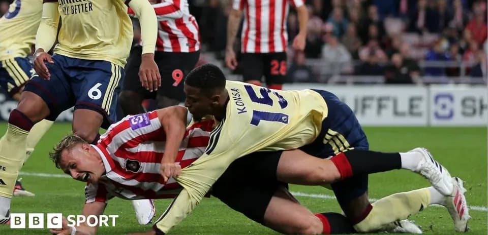 Players entangled on the ground during a match