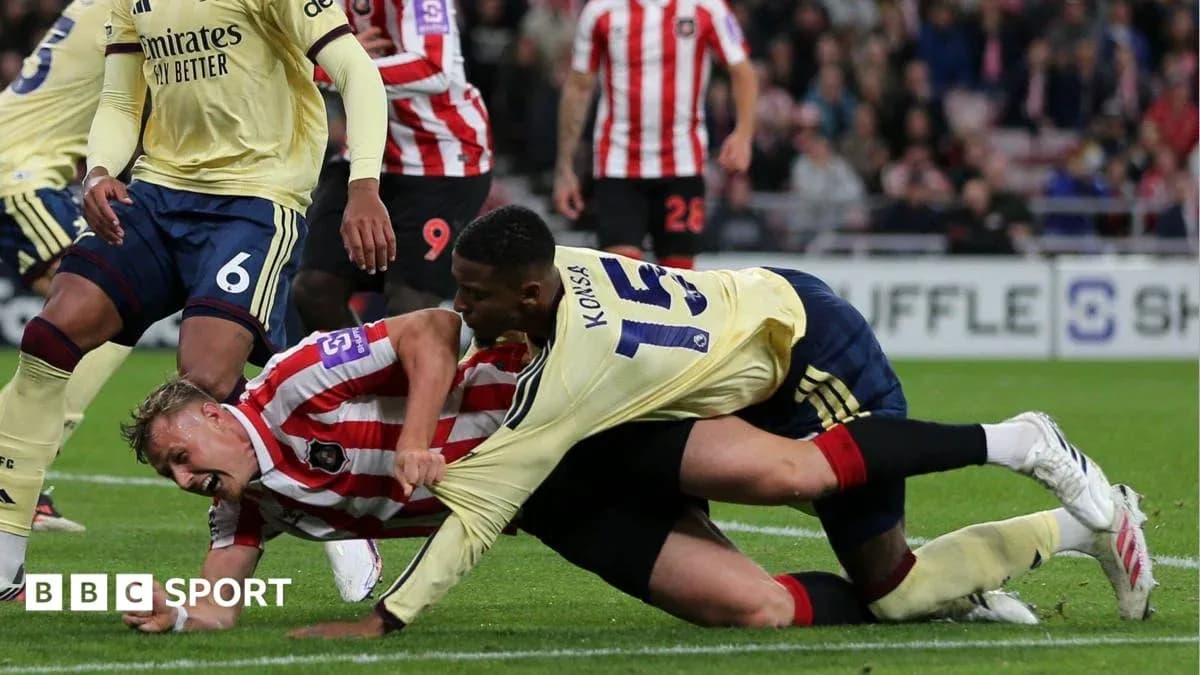 Players entangled on the ground during a match