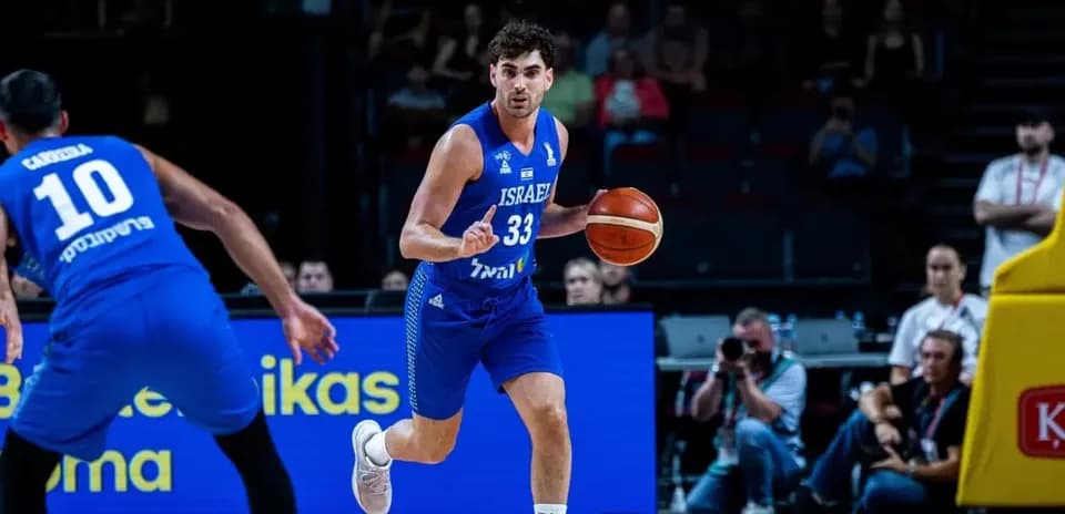 Player dribbling basketball during game action