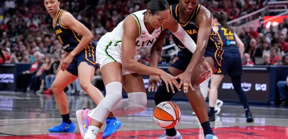 Two players battling for the basketball on court