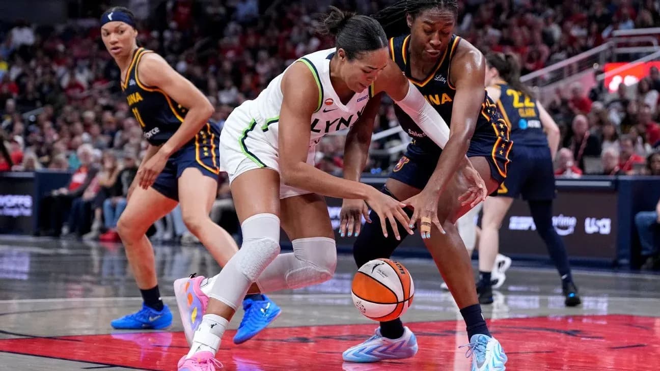 Two players battling for the basketball on court