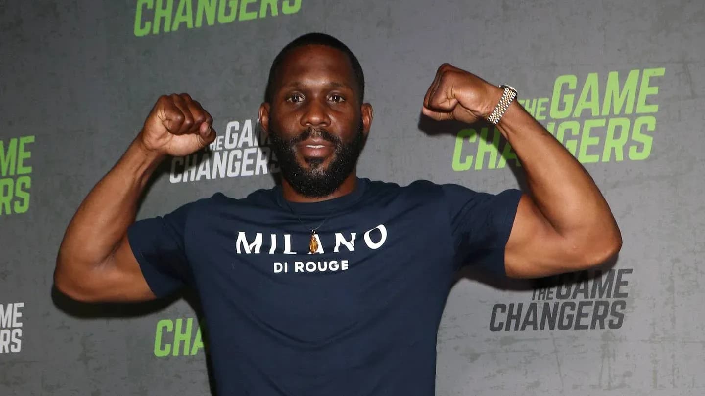 Man flexing muscles at promotional event