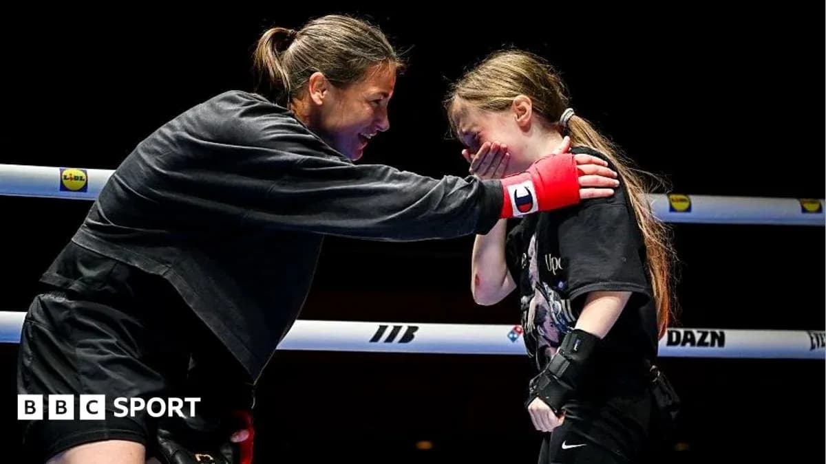 Boxer training with young girl in the ring