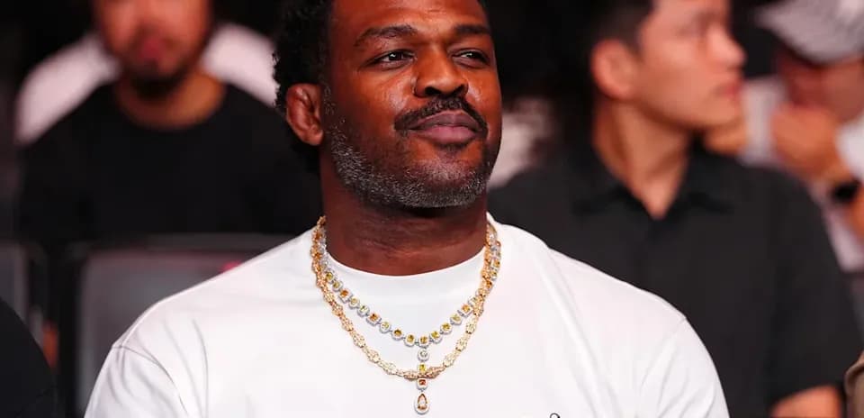 Man wearing jewelry at a sporting event