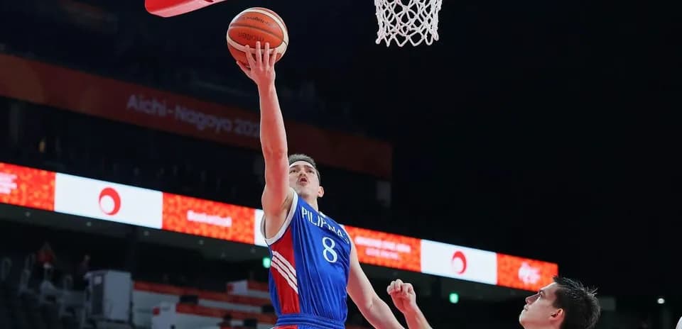 Player attempting a layup during basketball game