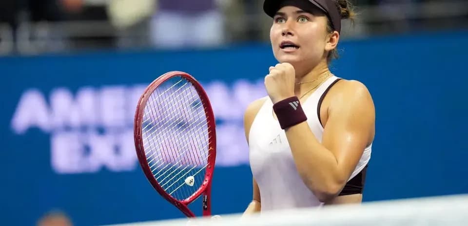 Tennis player celebrating a point during match