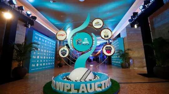 WPL auction display with team logos and decorations