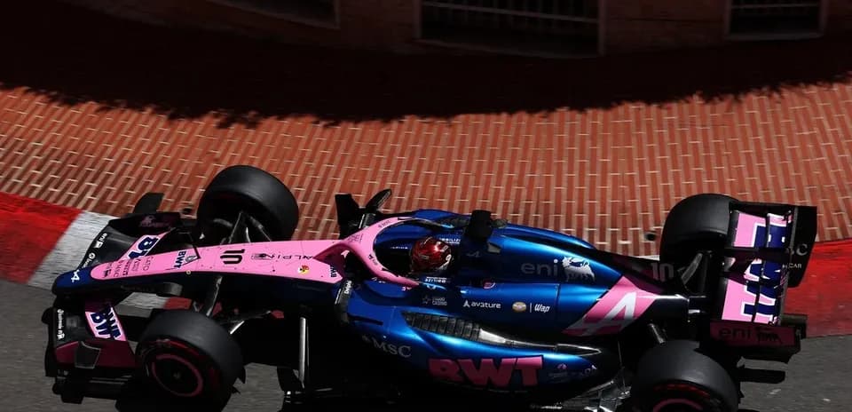 Race car navigating a turn on a street circuit